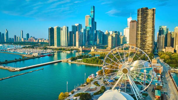 Navy Pier, its Ferris wheel and the Chicago skyline from above on a sunny day